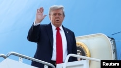U.S. President Trump boards Air Force One as he departs for Alaska to meet with Russian President Putin