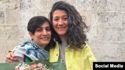 Elaheh Mohammadi (left) and Niloofar Hamedi face new charges just hours after being released from prison.