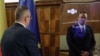 Romanian Prime Minister Nicolae Ciuca speaks to political adviser Ion (John in English) at its unveiling on March 1.