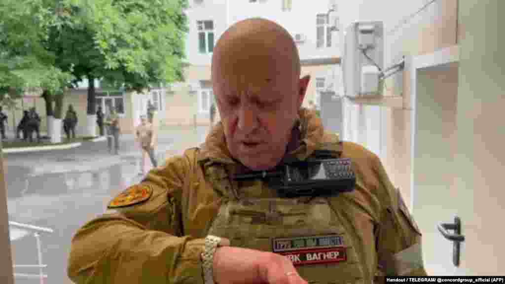 A video grab purporting to show Prigozhin inside the headquarters of the Russian southern military district on June 24.  Prigozhin claimed on June 23 that a Wagner camp in Ukraine had been hit “from the rear” by a missile and accused the Russian military of carrying out the strike.