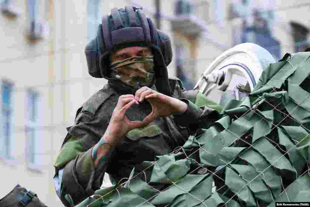 A man reportedly belonging to Wagner gestures to a photographer on the morning of June 24.  Russia’s Defense Ministry called the "strike" claim a provocation, and some pro-Kremlin figures claimed the video showing the alleged aftermath was staged. 