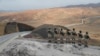 Turkish forces man the new border wall along the Turkish-Iranian border in Turkey's Van Province.