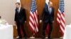 U.S. Secretary of State Antony Blinken (left) and Russian Foreign Minister Sergei Lavrov move to their seats before their meeting in Geneva on January 21.