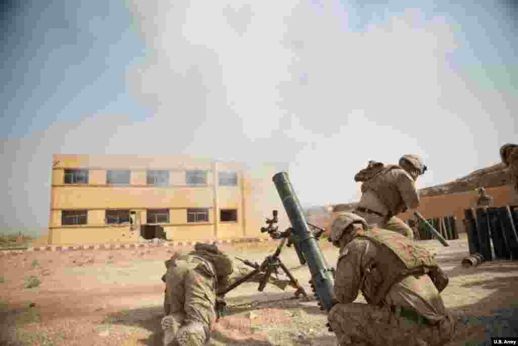 U.S. Marines pop a mortar towards an IS target in eastern Syria in October 2018. U.S. forces have also launched "kill or capture" missions targeting prominent IS leaders. 