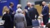 European Commission President Ursula von der Leyen (center) speaks with European Council President Charles Michel (third from right) with other EU leaders during a special meeting of an emergency summit called to discussion Russia's invasion of Ukraine.