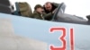 In a photo released by his press service on December 27, 2019, Armenian Prime Minister Nikol Pashinian is shown being briefed on the technical capabilities of Su-30SM fighter jets while sitting inside a cockpit.
