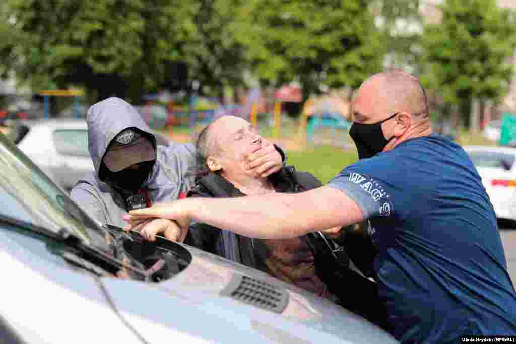 Unidentified men use force against a supporter of Sevyarynets.  