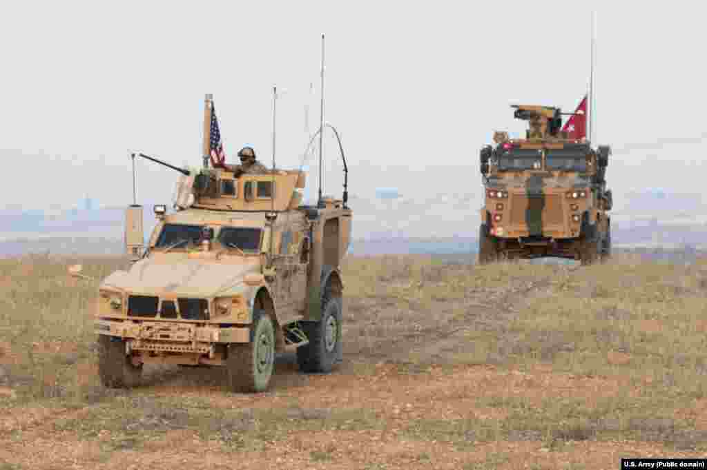 U.S. and Turkish forces conduct joint patrols on the outskirts of Manbij in November 2018. Syria is today an "ever congested" battle space, with U.S.-, Turkish-, Syrian-, Russian-, and Iranian-affiliated fighters all variously cooperating and clashing in the country. 