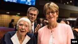 Veteran Russian human rights defender Lyudmilla Alekseyeva and co-founder of the Moscow Helsinki Group (L) receives the third Vaclav Havel Human Rights Prize from Anne Brasseur (right), the President of the Parliamentary Assembly of the Council of Europe (PACE), in Strasbourg late last year.
