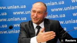 Ukraine's ultranationalist Right Sector group has poured scorn on allegations that the business card of one of its leaders Dmytro Yarosh (pictured) was found at the scene of a shoot-out near Slovyansk. It seems a large portion of the Internet community has also scoffed at the claim. (file photo)