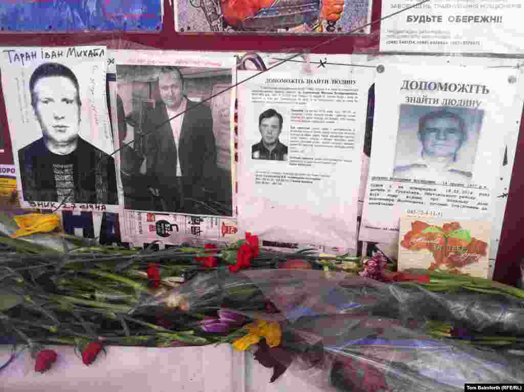 Pictures of missing people on Independence Square. 