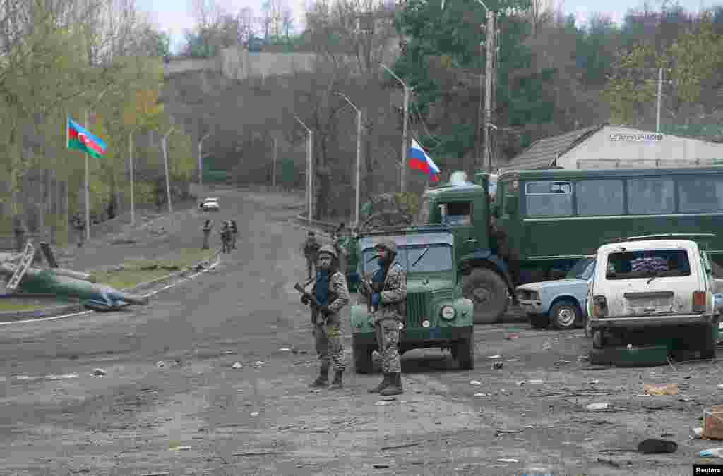 Azerbaijani soldiers guard a checkpoint on the outskirts of Shushi/Susa on November 13. 
