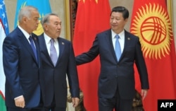 Septuagenarian Presidents Islam Karimov (left) of Uzbekistan and Nursultan Nazarbaev of Kazakhstan (center) walk with Chinese President Xi Jinping at a summit of the Shanghai Cooperation Organization in Bishkek in September 2013.