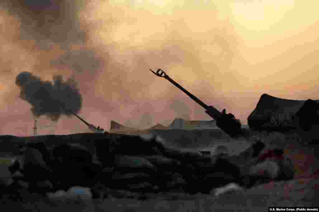 U.S. Marine howitzers pummel an IS position during the four-month battle for Raqqa, the de facto "capital" of the Islamic State group until the city was liberated in October 2017. 