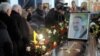 Mourners pass the coffin and photo of Yuriy Verbytskyy, a 51-year-old activist and antigovernment protester on Kyiv's Independence Square, during his funeral in Lviv on January 24.