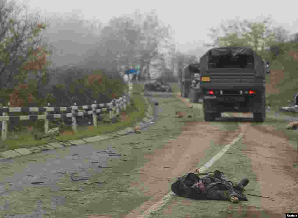 A body lies on the road near Shushi (known as Susa in Azeri). The pictures in this gallery were shot from a convoy of Russian peacekeepers driving near the town on November 13. The insertion of Russian peacekeepers into the region was part of a cease-fire agreement between Azerbaijan and Armenia made on November 9. 