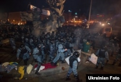 Berkut riot police disperse protesters on the Maidan in Kyiv on November 30, 2013.