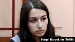 Krestina Khachaturyan, one of three teenage sisters accused of murdering their father, attends a court hearing in Moscow on June 26.