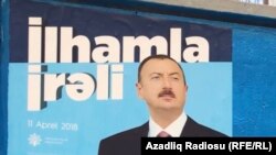 An election campaign poster for Azerbaijani President Ilham Aliyev who is expected to easily win a new term of office later this month.