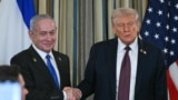 US President Donald Trump (right) and Israeli Prime Minister Benjamin Netanyahu shake hands at the conclusion of a joint press conference in the State Dining Room of the White House in Washington, DC, on September 29