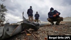 Members of a mine-clearing survey team examine unexploded items of ordnance in the war-torn Nagorno-Karabakh region earlier this month.