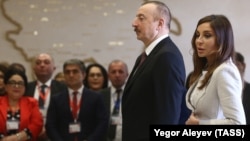 Azerbaijani President Ilham Aliyev and his wife Mehriban Aliyev arrive to vote at a Baku polling station on April 11.