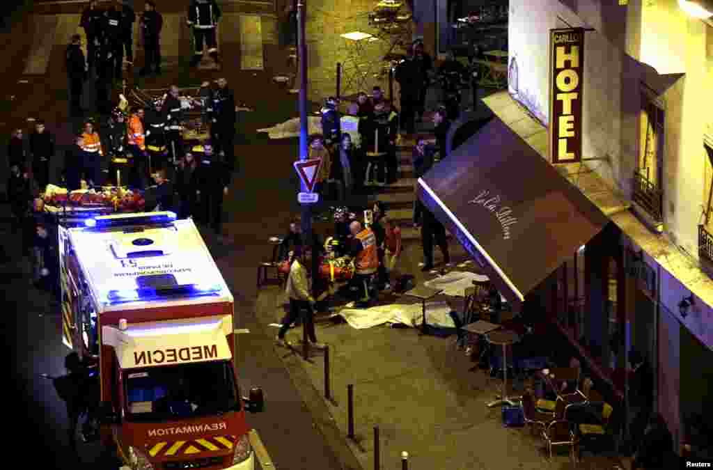 Rescue service personnel work frantically at the scene of the attack. 
