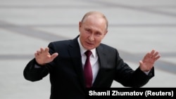 As Russians wonder about the future, Putin talks about the past.